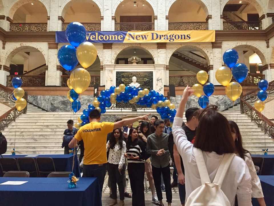 new students coming into Main Building for orientation programs